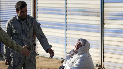 A woman reacts as she searches for her relatives at the site of a suicide attack in Kabul, Afghanistan February 1, 2016. REUTERS/Omar Sobhani