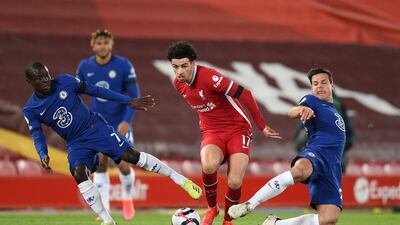 Liverpool's Curtis Jones with Chelsea's N'Golo Kante and Cesar Azpilicueta. Reuters