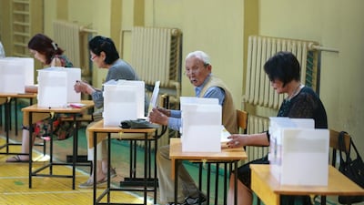 Mongolians vote at a polling station in Ulaanbaatar during the presidential election on June 26, 2017. Byamba-Ochir Byambasuren / EPA