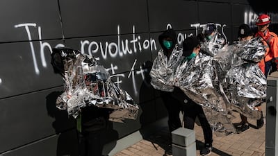 Injured protesters leave for the hospital at The Hong Kong Polytechnic University in Hong Kong. Getty Images