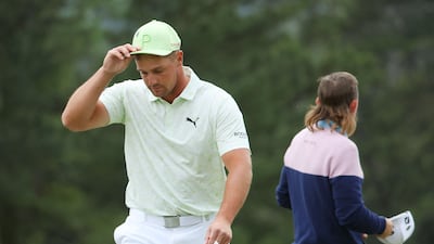 Bryson DeChambeau reacts on the 18th green after finishing his second round at The Masters at Augusta National Golf Club on April 8, 2022. The world No 22 missed the cut after shooting a 76 and an 80. Getty / AFP