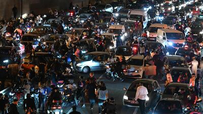 PSG supporters and motorists halt on the Peripherique between Porte Maillot and Porte Champerret in Paris early June 1, 2025, during celebrations following their 5-0 victory in the Uefa Champions League final. AFP