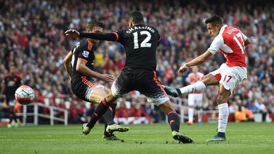Alexis Sanchez scores the third goal for Arsenal. Reuters