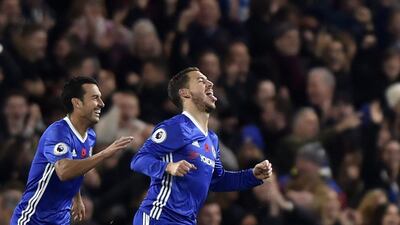 Chelsea's Eden Hazard, right, celebrates scoring their fourth goal against Everton. Hannah McKay / Reuters