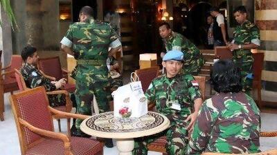 UN observers at their residence in the Dama Rose Hotel in Damascus. The 300 unarmed monitors are unlikely to have their mission extended after next month.