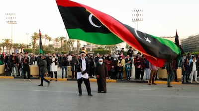 Libyans celebrate the 70th anniversary of their country's independence, despite widespread disappointment over the postponement of presidential elections, in Martyrs' Square, Tripoli, on December 24, 2021. AP