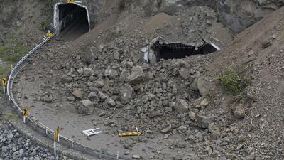 Landslides block a tunnel on State Highway One. David Alexander / SNPA via AP