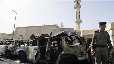Members of the Saudi security services inspect the site of a car bomb attack targetting Shiite Saudis attending Friday prayers at a mosque in Dammam, Saudi Arabia. EPA