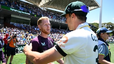 England captain Ben Stokes shakes hands with Australia counterpart Pat Cummins after losing the third Testin Adelaide. Getty Images