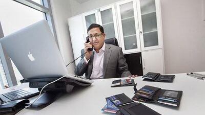 Atul Dhawan with his 14 credit cards in his three wallets. Intelligent use of the card can save a lot of money,he says. Jaime Puebla / The National