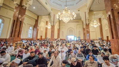 Worshippers gather for Friday prayers at Al Qasba mosque in Sharjah. Ahmed Ramzan / The National