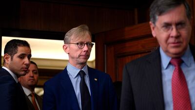 Brian Hook (C), US Special Representative for Iran and Senior Policy Advisor to the Secretary of State, arrives before the US Secretary of State Mike Pompeo held a press conference with Egyptian Foreign Minister Sameh Shoukry at the Ministry of Foreign Affairs in Cairo on January 10, 2019. Pompeo also met with Egyptian President Abdel Fattah al-Sisi today, on the third leg of a regional tour to address concerns of American allies in the Middle East. / AFP / POOL / ANDREW CABALLERO-REYNOLDS