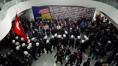 Riot police enter the headquarters of Zaman newspaper in Istanbul on March 4, 2016. AP Photo