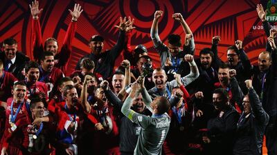 Serbia players celebrate after winning the under-20 World Cup. Hannah Peters / Getty / June 20, 2015