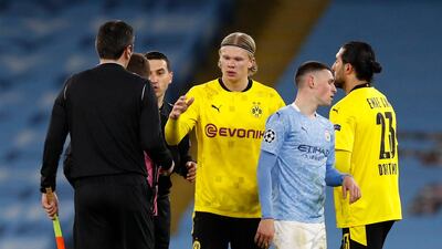 Borussia Dortmund striker Erling Braut Haaland shakes hands with the match officials at the end of the 2-1 defeat to Manchester City. Reuters