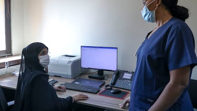 Ms Al Menhali speaks to charge midwife Ngozi Laureta Obi. Khushnum Bhandari / The National