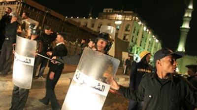 Egyptian policemen block the way leading to the site of the explosion in Cairo.