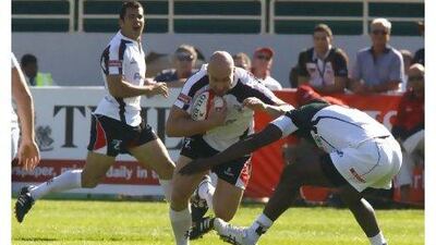 The Gulf’s Rory Binder on the rampage against Zimbabwe at the Dubai Sevens.