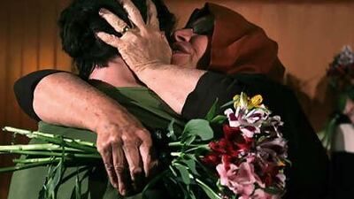 Laura Fattal hugs her son Josh at the Esteghel hotel in Tehran, Iran. It was their first meeting since Josh and two other American hikers were imprisoned nine months earlier.