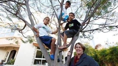 Therese Sequeira at home in Dubai with her children Anton, Simeon and Dominic. Sarah Dea / The National