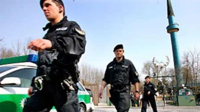 Police officers leave the Islamic Centre in Munich, in April 2005, after searching for evidence of terrorist activity.