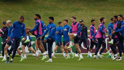England players warm-up at training.