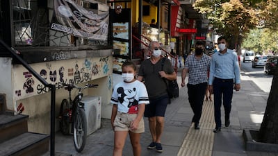 People walk on a street in Ankara. The Turkish capital has now the highest number of active coronavirus cases, having overtaken Istanbul. AP Photo