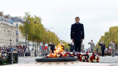 French President Emmanuel Macron at the Tomb of the Unknown Soldier during a ceremony at the Arc de Triomphe, as part of commemorations to mark Armistice Day in Paris. Reuters