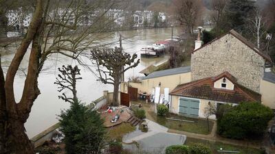Foodwater from the Seine river in the backyard of a house in Bougival, west of Paris. Stephane De Sakutin / AFP
