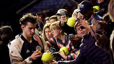 Thiem signs autographs after winning his semi final, and he takes on Greek 21-year-old Stefanos Tsitsipas in the final on Sunday. EPA