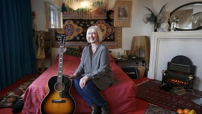Kathy Etchingham sits on a bed in the restored bedroom of the home where they lived in 1968-69 London. The third floor Mayfair flat will open to the public on February 10, following at 2.4 million pound, two year restoration, which is also the former home of composer, George Frederic Handel. Peter Nicholls / Reuters