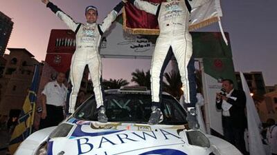 Nasser Saleh Al Attiyah, right, with co-driver Giovanni Bernacchini of Italy, overcame several problems, including striking a tree and tyre punctures, to win the Dubai International Rally and ensure Al Attiyah of a seventh Middle East Rally Championship title