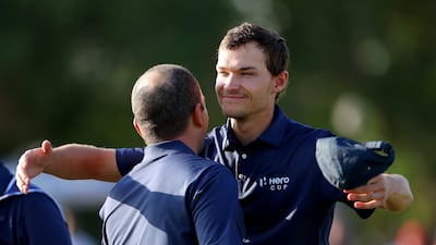 Nicolai Hojgaard and Francesco Molinari of Continental Europe celebrate after winning on the 17th hole against Ewen Ferguson and Richard Mansell in the foursomes on Day Two of the Hero Cup at Abu Dhabi Golf Club on January 14, 2023. Getty