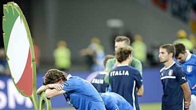Italian players look dejected after the Euro 2012 football championships final match Spain vs Italy on July 1, 2012 at the Olympic Stadium in Kiev. Spain won 4-0. TOPSHOTS / AFP PHOTO / FILIPPO MONTEFORTE