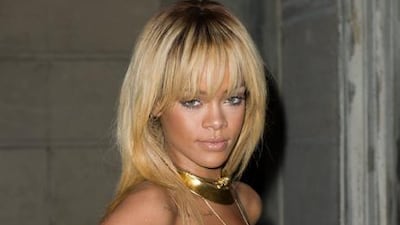 The singer Rihanna is reportedly remixing her song Birthday Cake with her ex-boyfriend Chris Brown. Jonathan Short / AP Photo