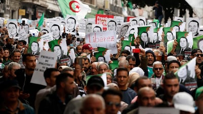 Three members of the Hirak protest group will face trial. AP Photo