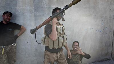 An Iraqi special forces soldier holds a rocket propelled grenade launcher in Bazwaya. Marko Drobnjakovic / AP Photo