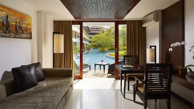 The balcony of the ground-floor rooms at the Melia is a mere step up from the lagoon-style pool. Courtesy: Melia Bali