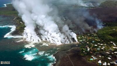 Lava from a fissure flowing into the ocean at Kapoho Bay on the island of Hawaii. After overrunning the town overnight and destroying hundreds of homes, the lava flowed into the shallow bay and had nearly filled it. US Geological Survey via AP