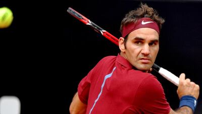 Switzerland’s Roger Federer returns the ball to Dominic Thiem of Austria during their match at the Italian Open. Tiziana Fabi / AFP