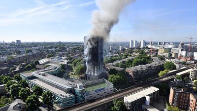 Smoke rises from Grenfell Tower, west London, which caught fire in the early hours of the morning of June 14, 2017. Getty Images