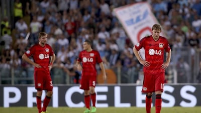 Bayer Leverkusen's Christoph Kramer, Kyriakos Papadopoulos and Stefan Kiessling shown after losing the Champions League play-off first leg match to Lazio on Tuesday. Alessandra Bianchi / Reuters