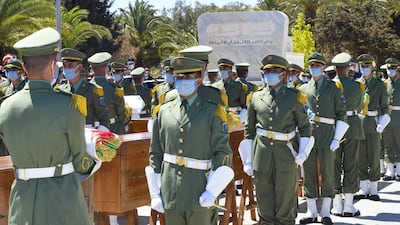 Algeria's Republican Guard stand with the coffins during a ceremony to lay to rest the remains of 24 resistance fighters, returned from Paris. AFP