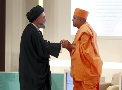 Lebanese scholar Ali Al Amin meets Hindu priest Swami Brahmavihari. Chris Whiteoak / The National