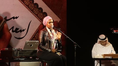 University of Sharjah student Noura Boush recites poems at the Hekaya cultural event in Abu Dhabi. Jeffrey E Biteng / The National