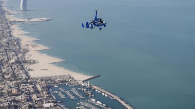 A gyrocopter flies over Dubai during the World Air Games 2015 on December 9. Witnesses said a gyrocopter crashed into the sea off JBR on Wednesday. Karim Sahib / AFP Photo