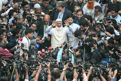 Bangladesh Jamaat-e-Islami party leader Shafiqur Rahman (C) gestures to the media after casting his vote at a polling station during Bangladesh's general election in Dhaka. AFP