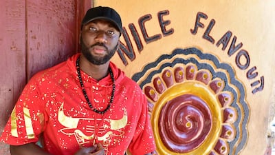 Sierra Leone popstar Emmerson posing outside his studio in Freetown, Sierra Loene. AFP