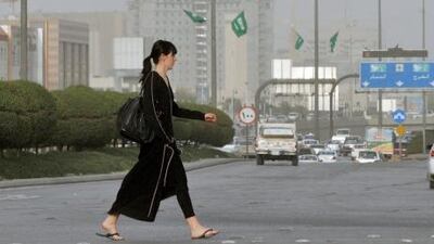 An expatriate crosses a main street in the Saudi capital Riyadh. AFP