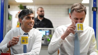 Britain's Prime Minister Rishi Sunak with Chancellor of the Exchequer Jeremy Hunt, who this week delivered a budget aimed at wooing voters ahead of a general election this year. AFP